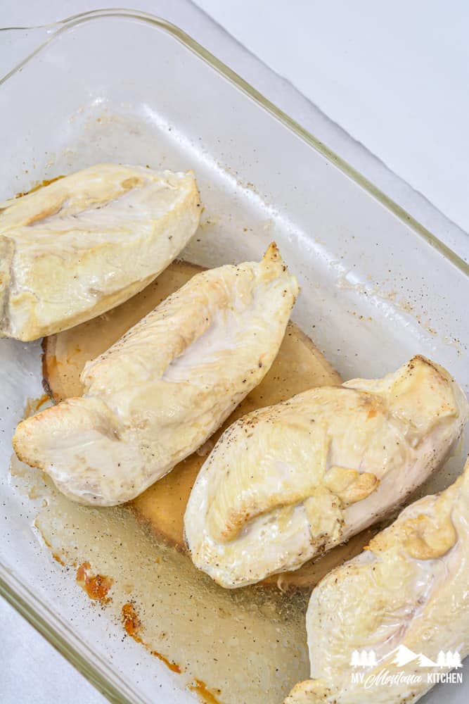 cooked chicken breasts in glass baking dish