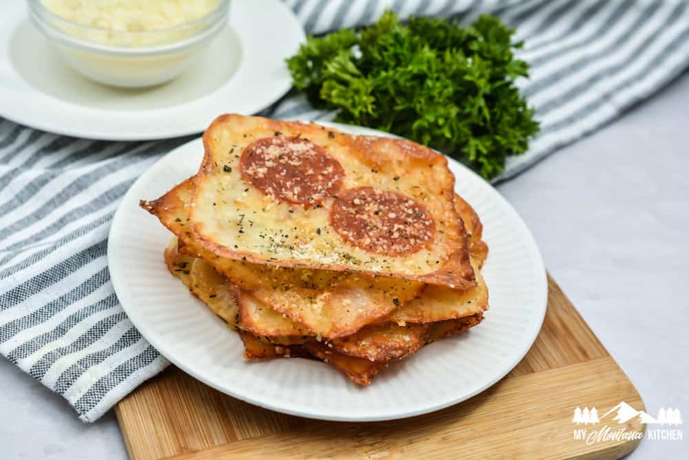 crispy keto pizza crackers on white plate