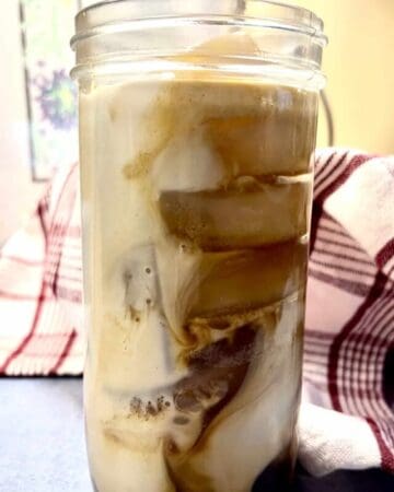 brown sugar shaken espresso with oat milk in glass jar