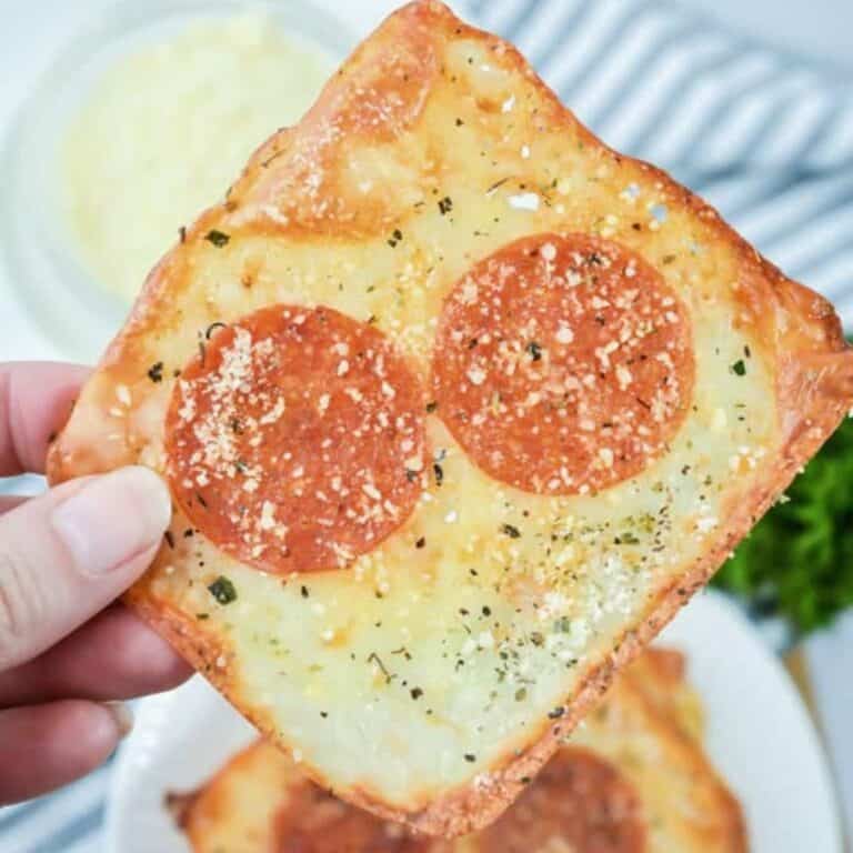 pizza cheese crackers on white plate