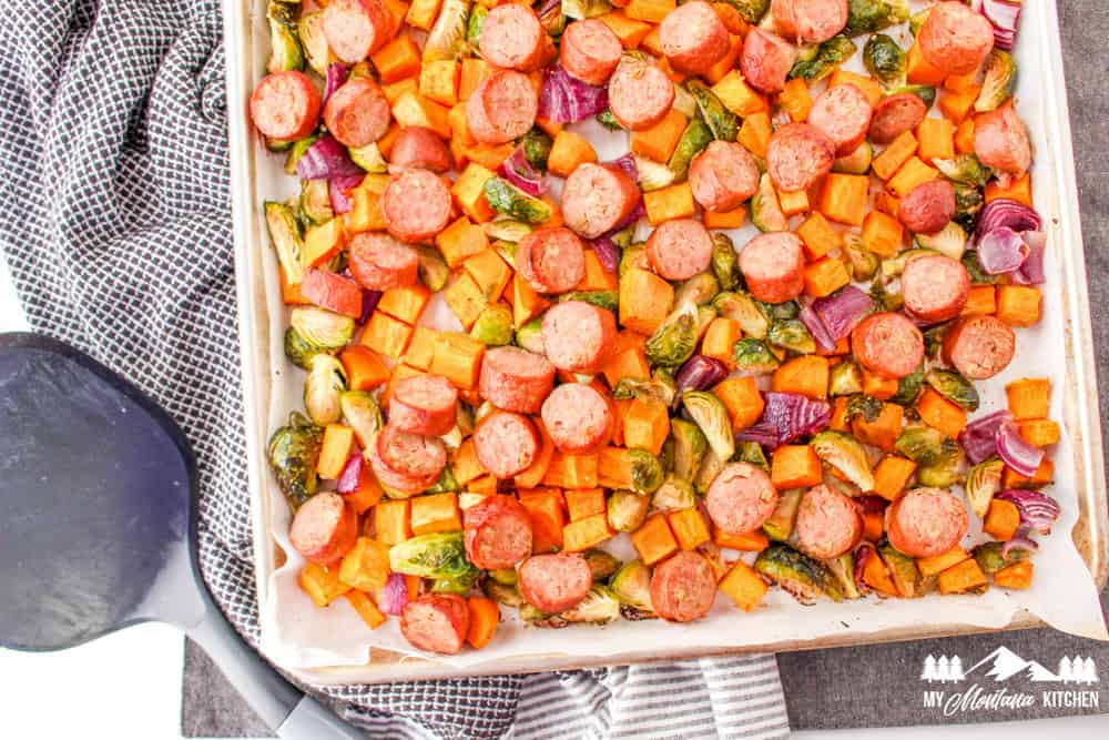 sausage, brussels sprouts, onion, and sweet potatoes on sheet pan