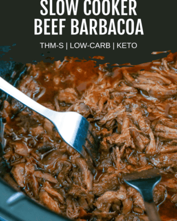 beef barbacoa in black slow cooker