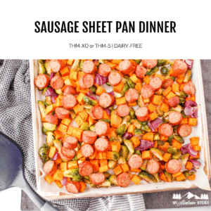 roasted vegetables and sausage on aluminum sheet pan