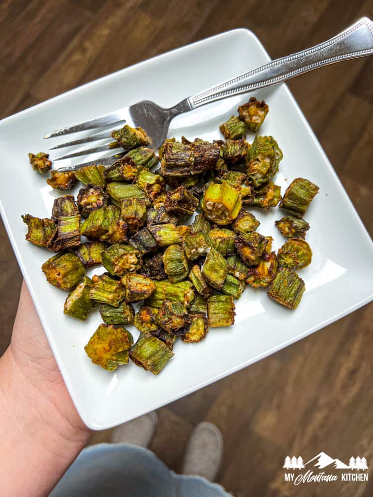 air fried okra on white plate with fork