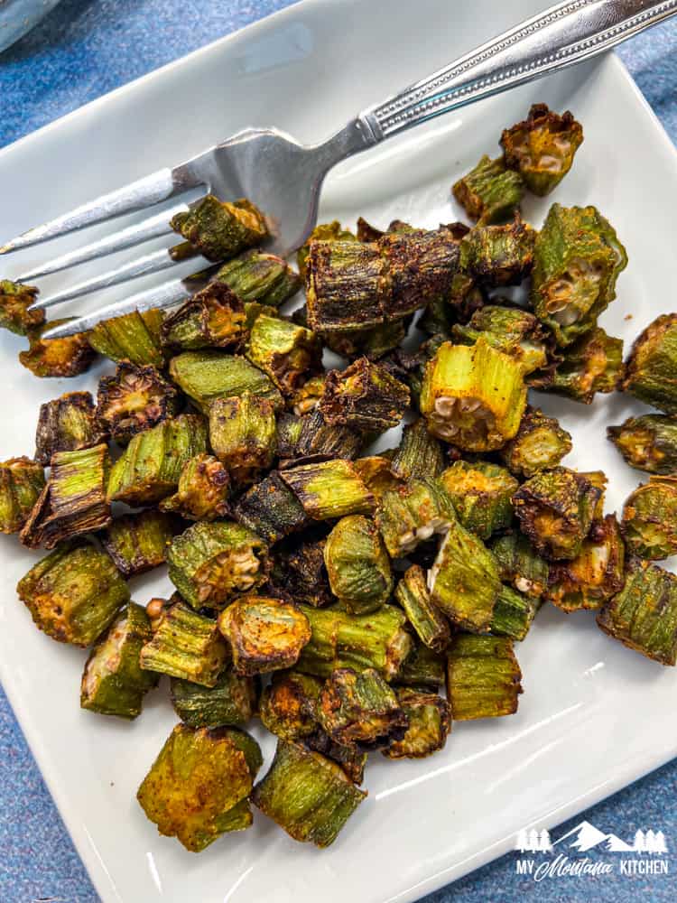 air fried okra on white plate with fork
