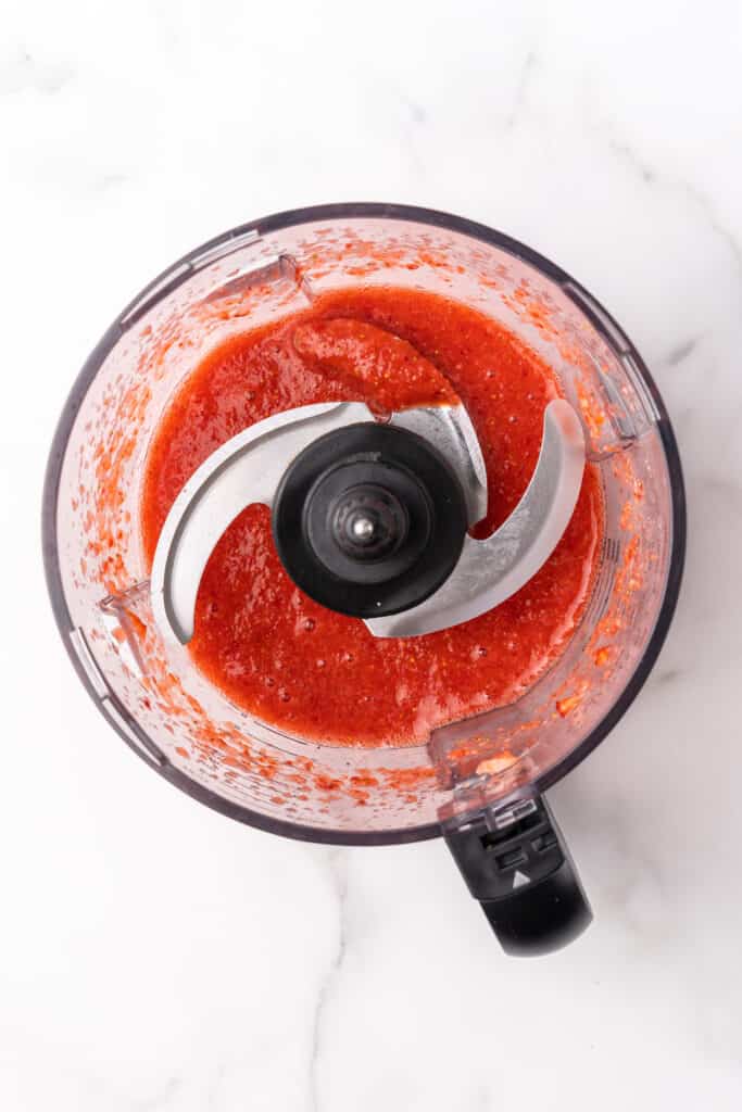food processor with blended strawberries
