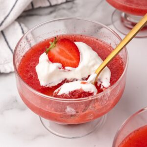 strawberry gelatin with whipped cream and fresh strawberry