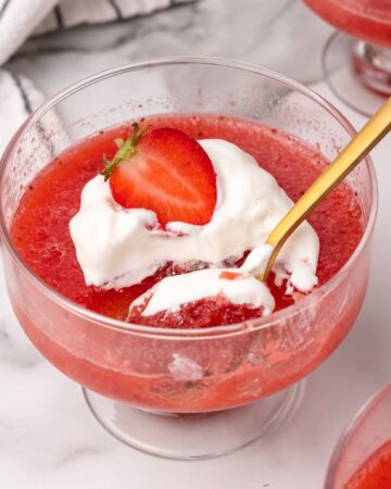 strawberry gelatin with whipped cream and fresh strawberry