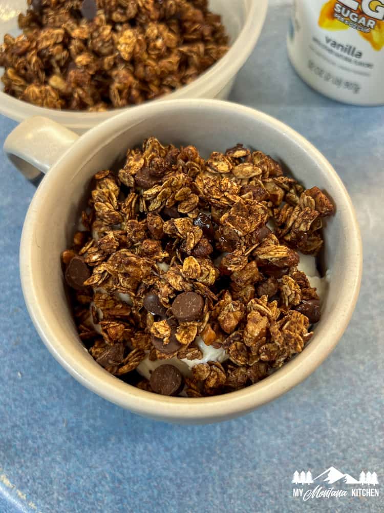chocolate air fryer granola with yogurt in mug