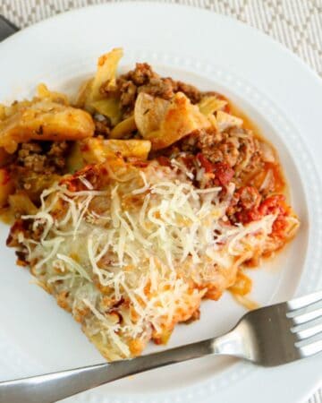cabbage roll casserole on white plate with fork