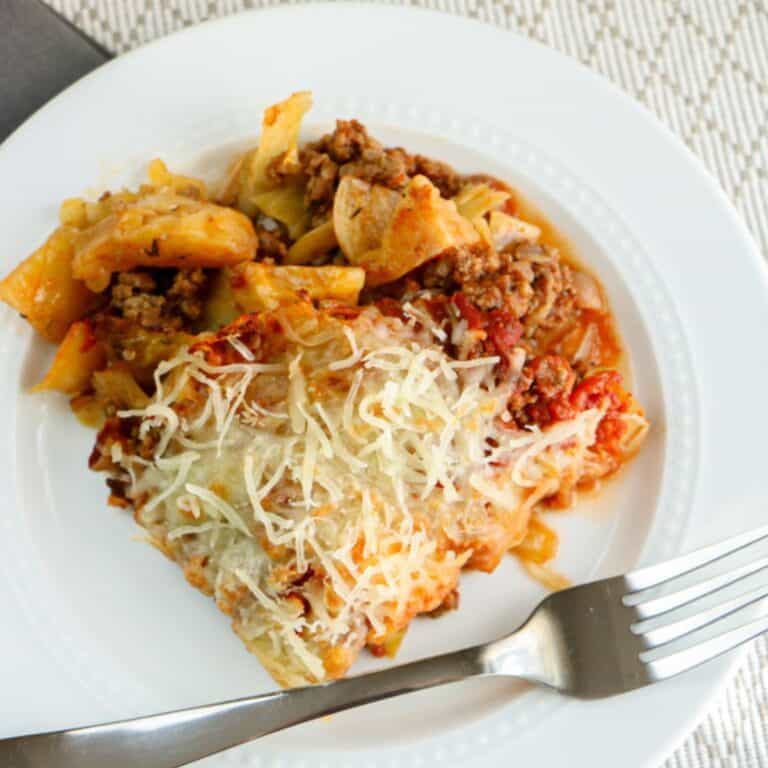 cabbage roll casserole on white plate with fork
