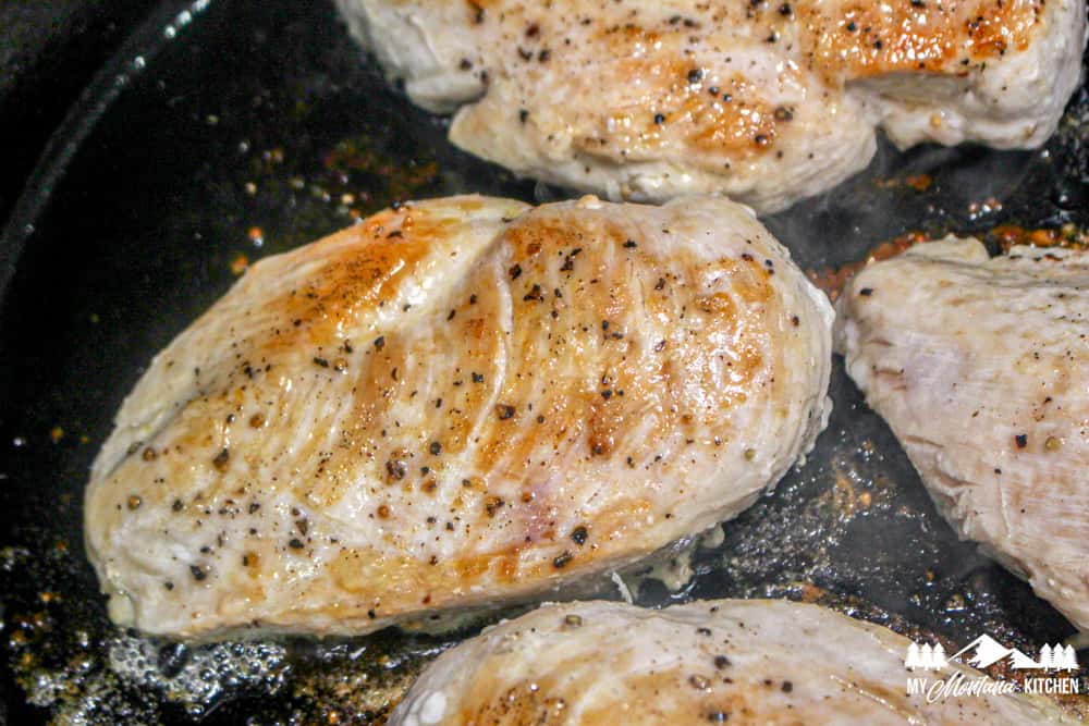 cooked chicken breasts in skillet