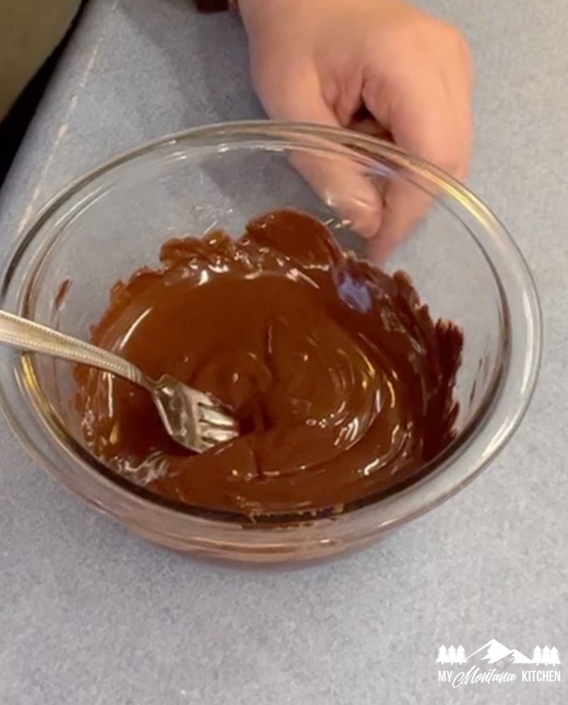 melted chocolate in glass bowl with fork