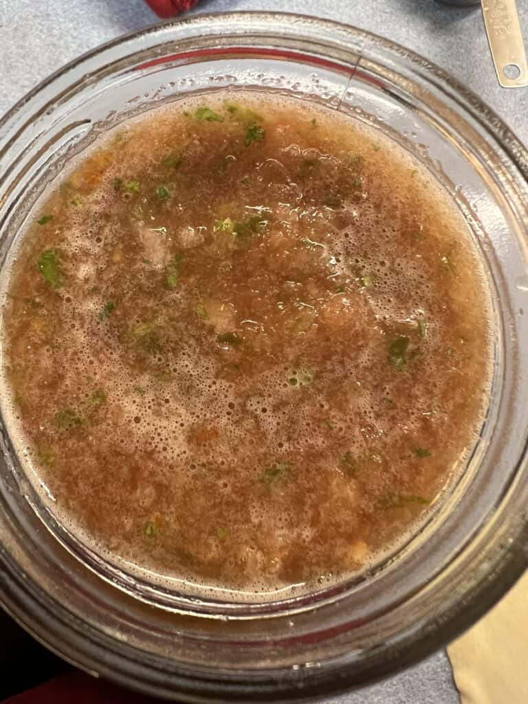 blended salsa in glass jar