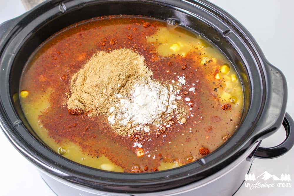 chicken broth and spices in crock pot