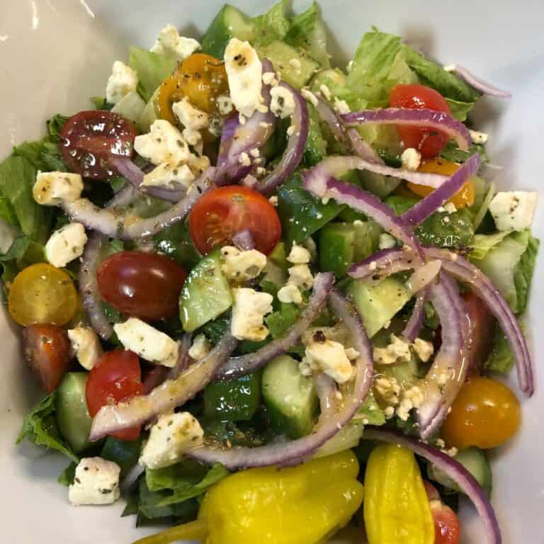 greek salad in white bowl