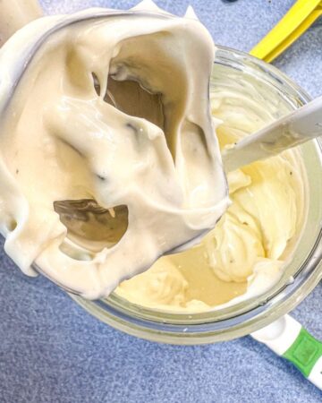 homemade avocado oil mayo on immersion blender blades