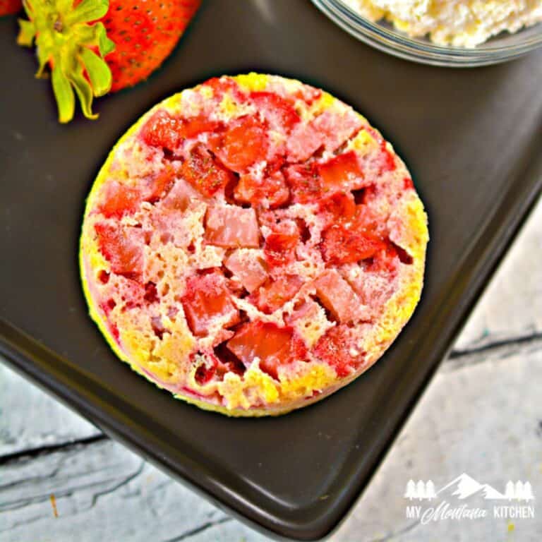 strawberry upside down cake on black tray