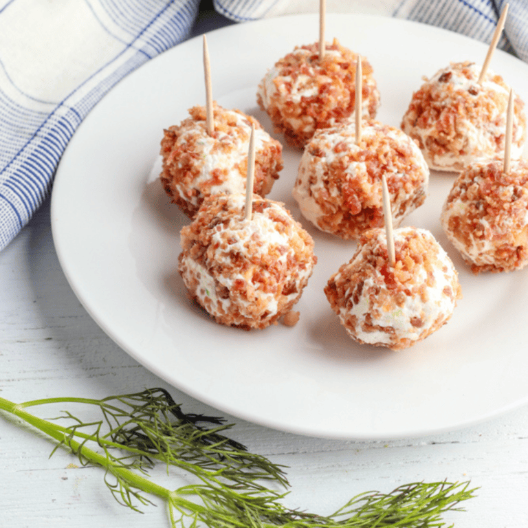 mini dill pickle cheese balls with bacon on white plate