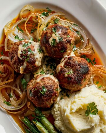 french onion meatballs on white platter