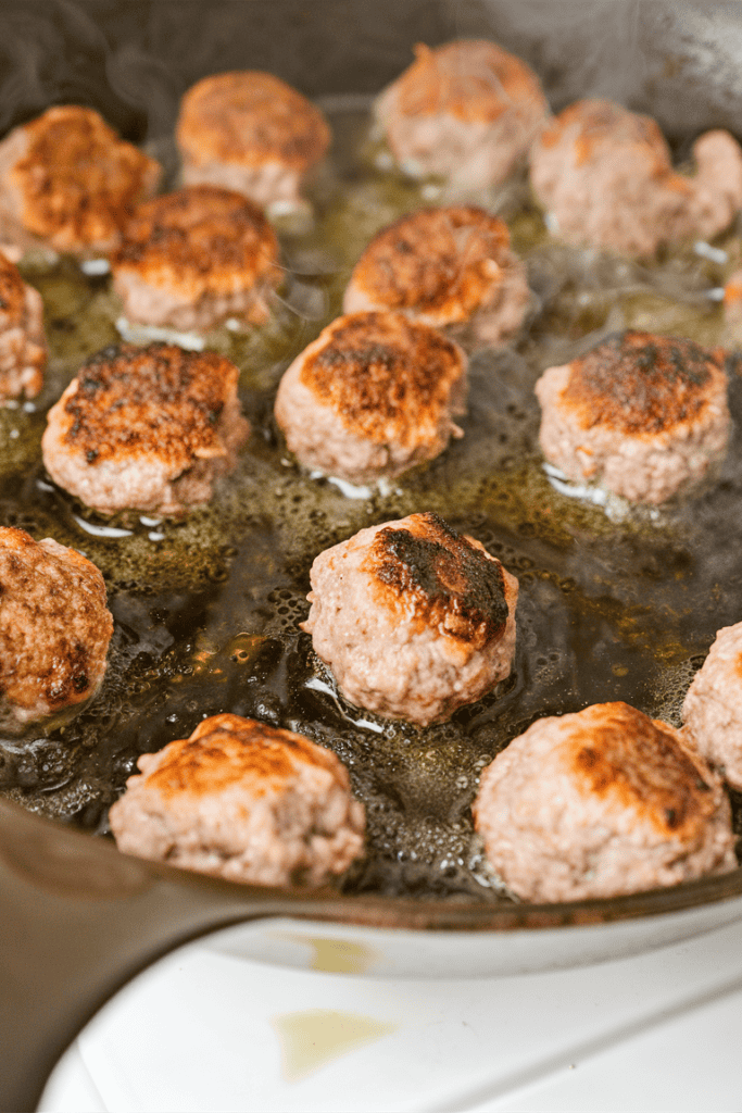 french onion meatballs frying in oil