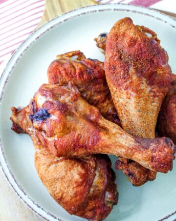 dry rub drumsticks on white plate