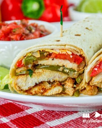 chicken fajita wraps on white plate