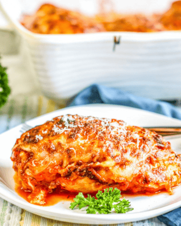 lasagna stuffed chicken breast on white plate