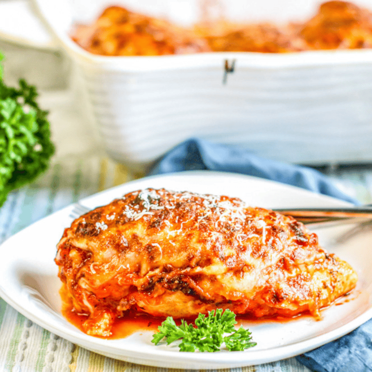lasagna stuffed chicken breast on white plate