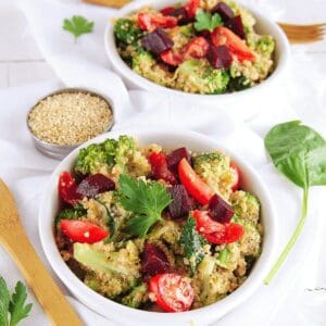 Quinoa Salad with beets and broccoli in white bowl