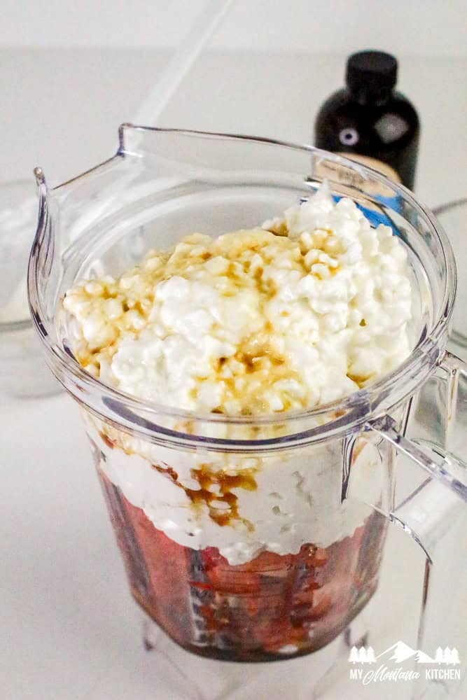 Ingredients in blender—cottage cheese, strawberries, vanilla