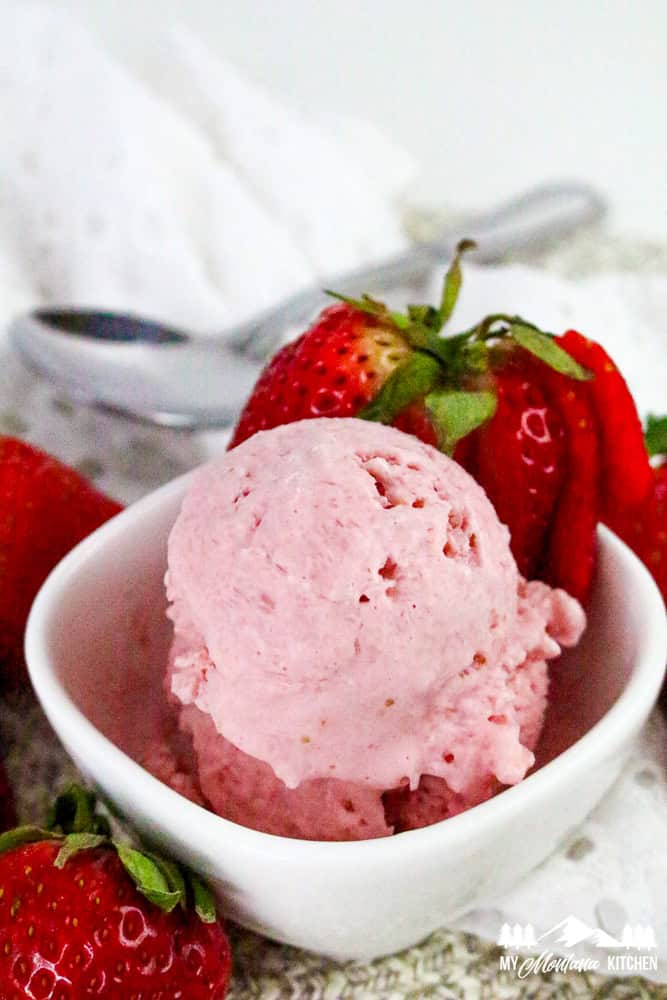 Strawberry cottage cheese ice cream served with whole strawberries