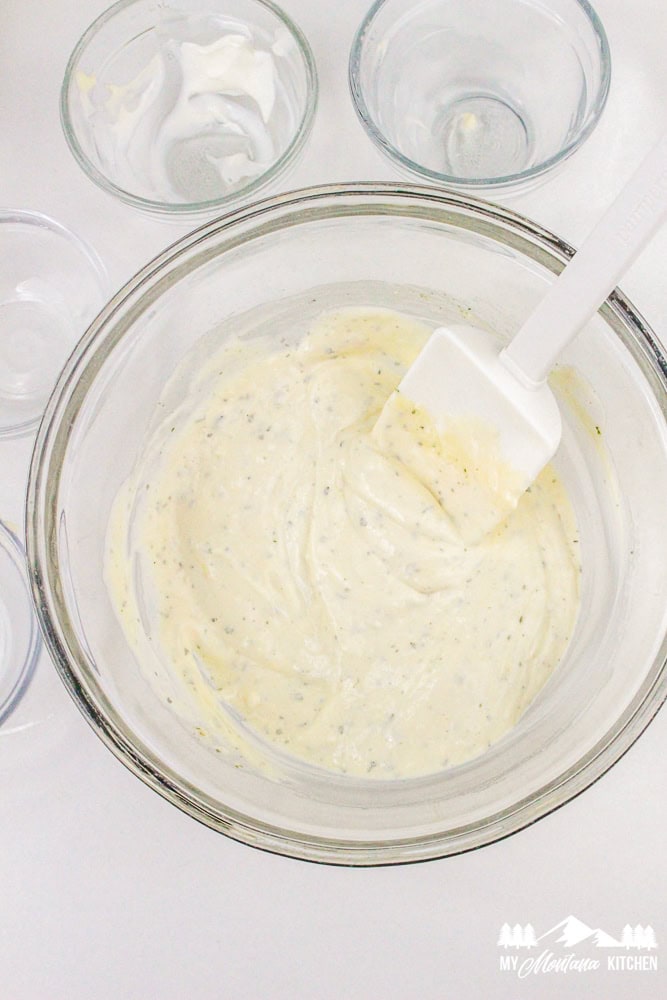 Finished ranch dressing in a mixing bowl, ready to be added to bacon ranch chicken salad.