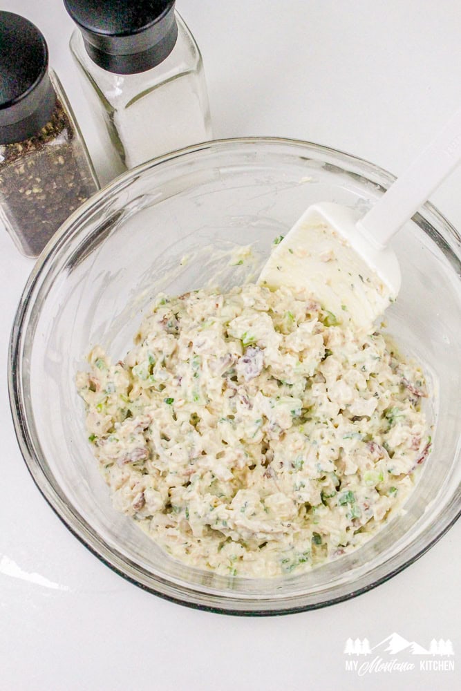 Mixing bowl filled with finished bacon ranch chicken salad ready to serve.