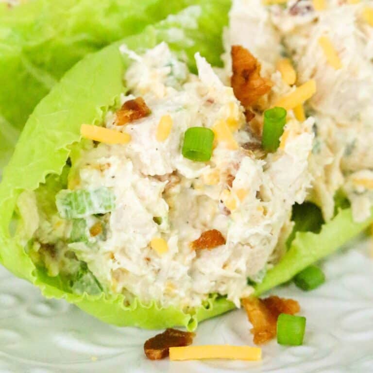 jalapeno popper chicken salad in lettuce on white plate