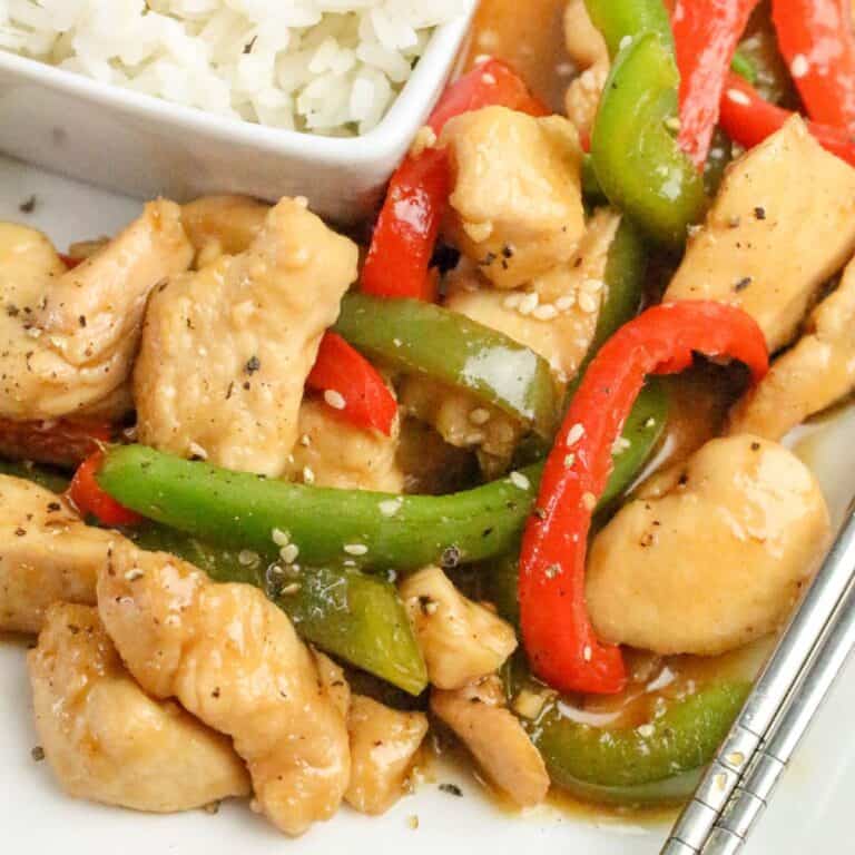 Honey pepper chicken served in a bowl with a sticky sweet honey glaze.