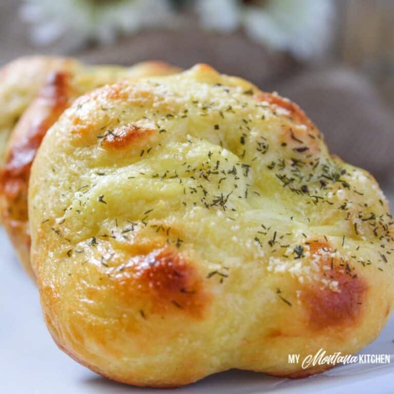 Cheese garlic bread roll with melted cheese and herbs, perfect for a savory snack or side dish.
